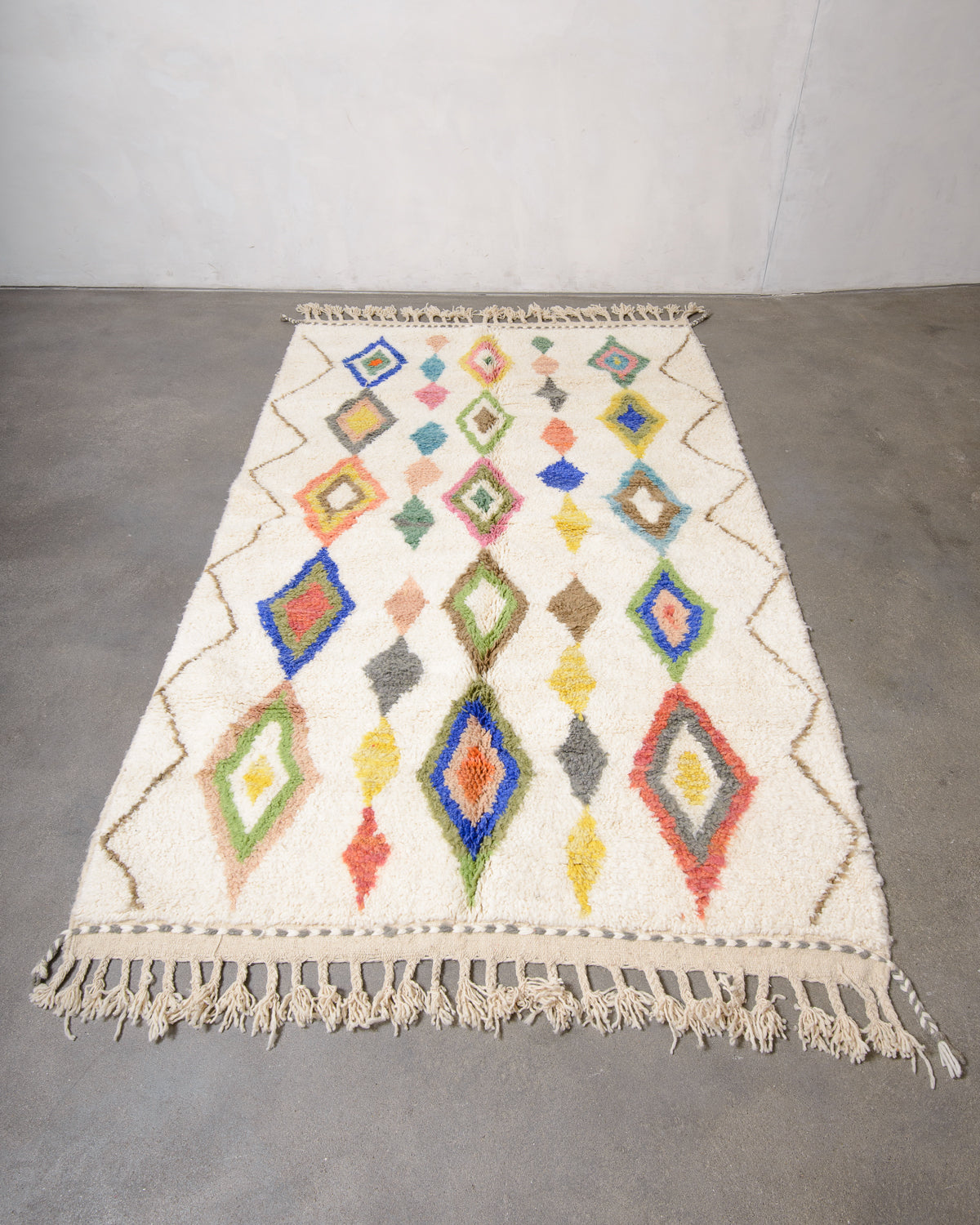 Modern, designer, handcrafted Berber rug from Morocco. Beniourain carpet with beautiful colours and patterns and fluffy wool texture.